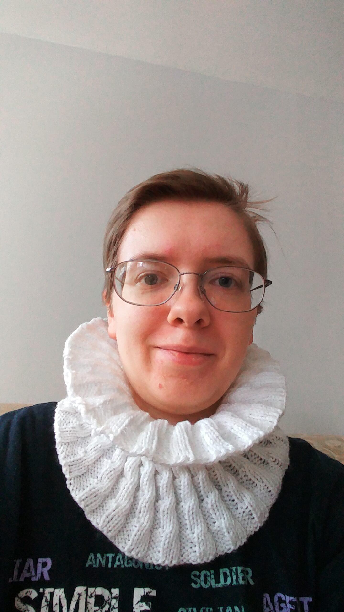 Me wearing the helical cowl, which is flopped down so that it forms a sort of high, wide collar around my face