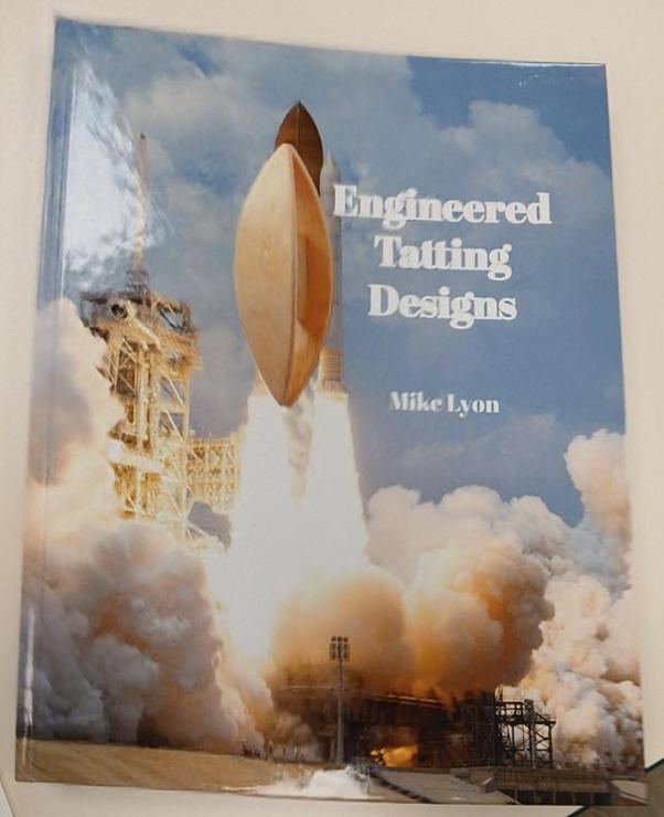 The hardcover of the book called "Engineered Tatting Designs" by Mike Lyon. It has a launch moment photo of the space shuttle, but also cover the real space one there is a tatting shuttle that appears to be launching instead. 