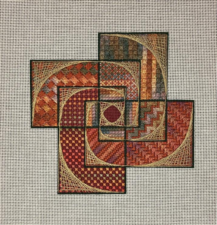 Completed needlepoint in reds, neutrals and golds suggestive of the Fibonacci sequence 