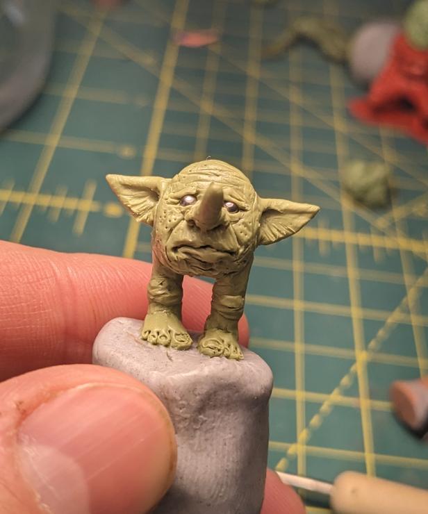 a little miniatures goblin sculpted out of green stuff + plasticine